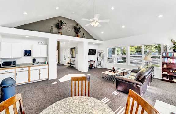 a living room with a couch and a table