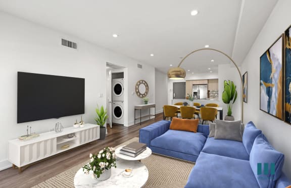 a bedroom with a bed and two blue stools