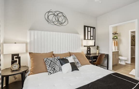a bedroom with a yellow bed and a ceiling fan