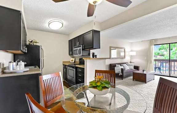 Model kitchen and dining area at Silver Reef Apartment Homes in Lakewood, CO