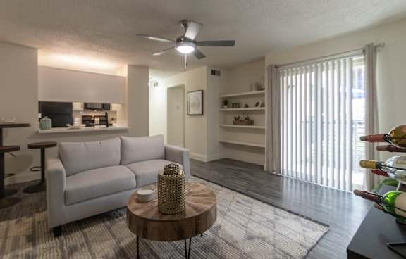 Photo of the living room in a 692 square foot 1 bed, 1 bath model aprtment at Cambridge Court Apartments in Dallas Texas