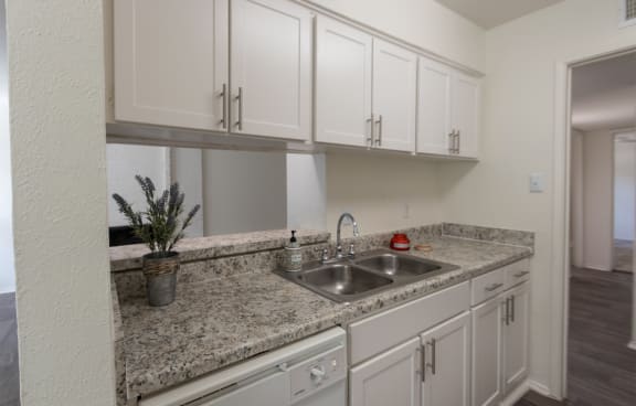 This is a photo of the kitchen in the 650 square foot 1 bedroom, 1 bath apartment at Preston Park Apartments in Dallas, TX