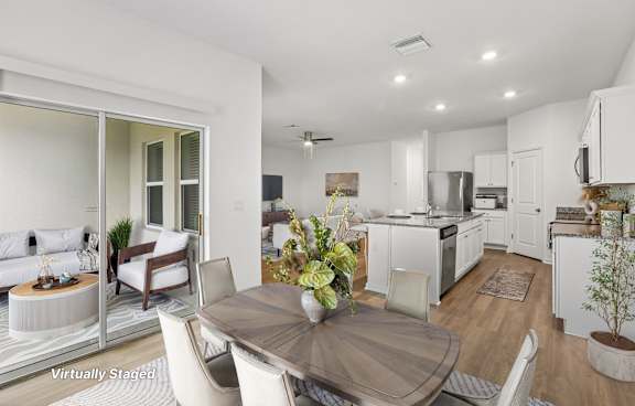 A kitchen with granite countertops and stainless steel appliances.