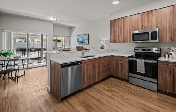 Peak42 Apartments in Bend, Oregon Model Kitchen and Dining Area with Private Patio