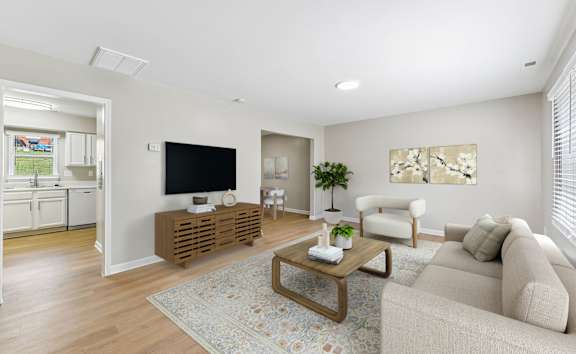 a family sitting on a couch in a living room at Sharon West, Charlotte, 28210
