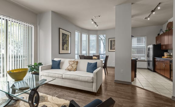 a living room with a couch and a table and chairs