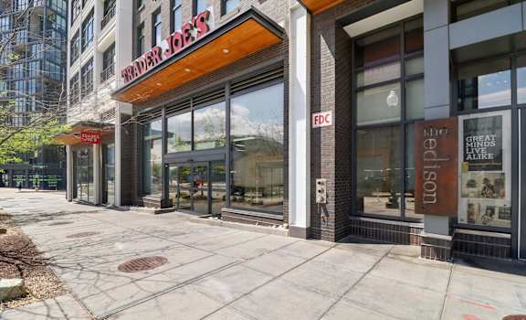 The exterior of a building with a red sign that says "Walden Jobs".