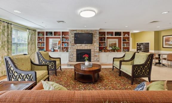 a living room filled with furniture and a fire place