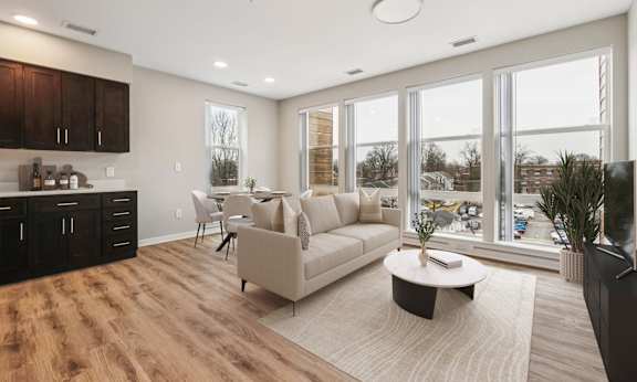A modern living room with a large couch and a coffee table.