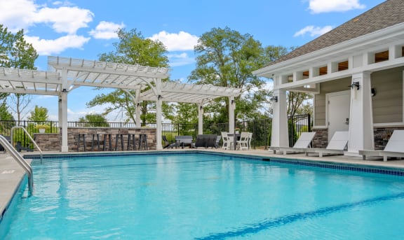 Outdoor Swimming Pool with Expansive Sundeck and Pergola
