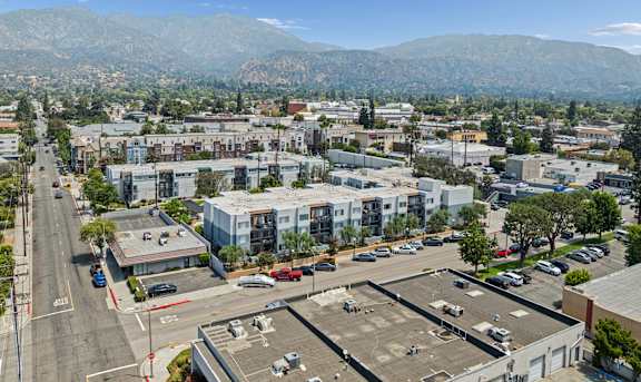 A cityscape with a large mountain range in the background.at Oak Park Apartments, Monrovia, CA 91016