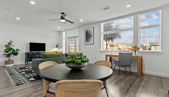 a kitchen with a large island and stainless steel appliances