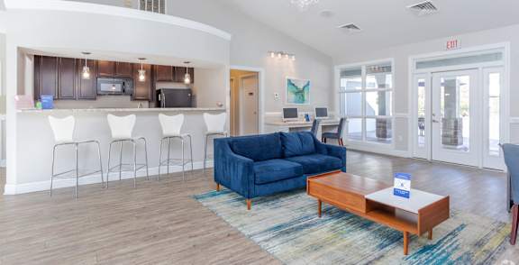 A row of washing machines in a laundromat.