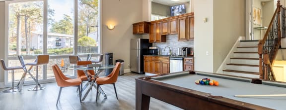 a living room with a pool table and a tv at Tucker Square, Stone Mountain, Georgia