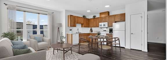 A modern kitchen with a dining table and chairs.