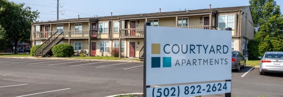 a building with a sign that says courthouse apartments