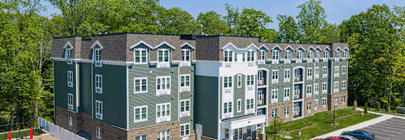 a rendering of a parking lot with cars in front of buildings