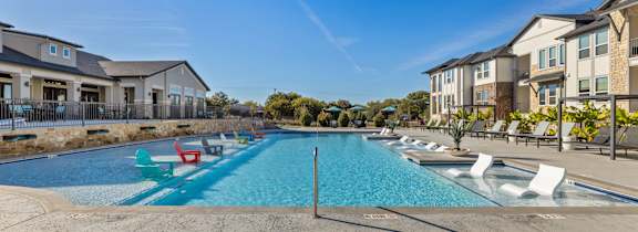A swimming pool with a blue sky in the background.