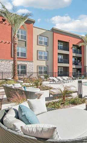 Lounge outdoor area with couches at The Maddox Luxury Apartment Homes, Buckeye, AZ 85326