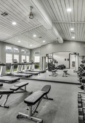 the generously sized gym has cardio equipment and treadmills at River Stone Ranch, Austin, Texas