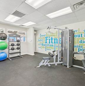 Gym with weight training equipments at Sycamore Square Apartments, Arizona