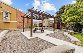 a picnic area with a picnic table in a courtyard