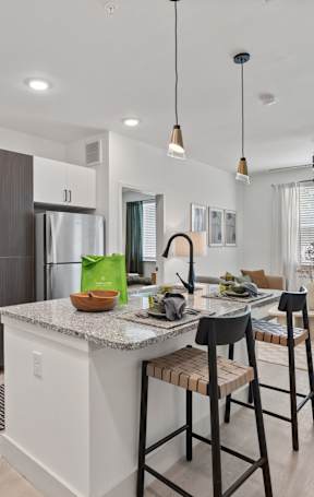 Kitchen with Island at Tapestry Woodland Hills Apartments, Humble, Texas