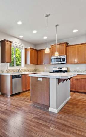 a kitchen with a large island in the middle of it