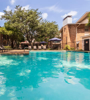 This is a photo of the pool area at Preston Park Apartments in Dallas, TX