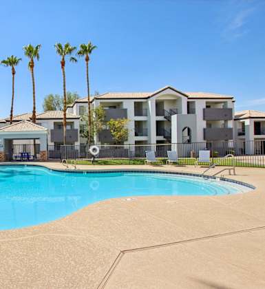 Star shape pool with table at The Village at Sun Valley Apartments, Arizona, 85207