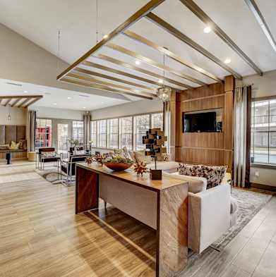 a large living room with a kitchen and a dining room
