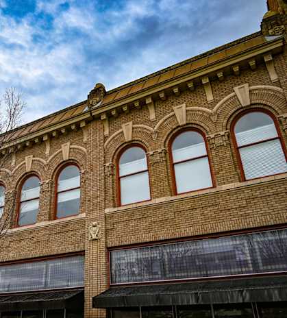 A building with arched windows and a brick facade.