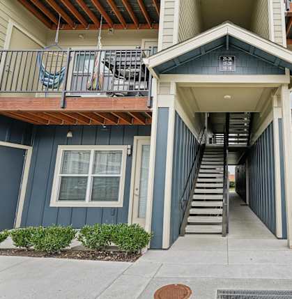 A building with a staircase leading to the entrance.