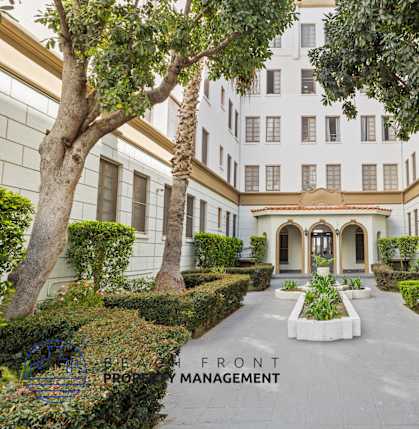 A building with a sign that says Front Management.
