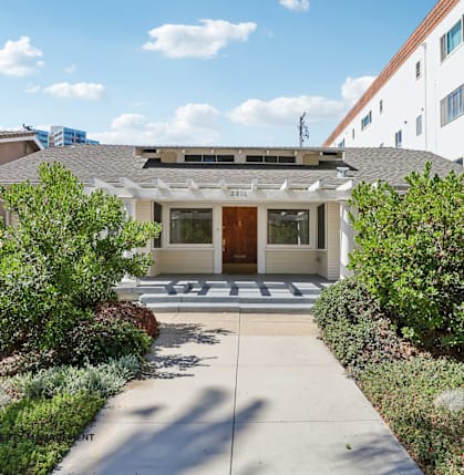 A house with a front yard and a driveway.