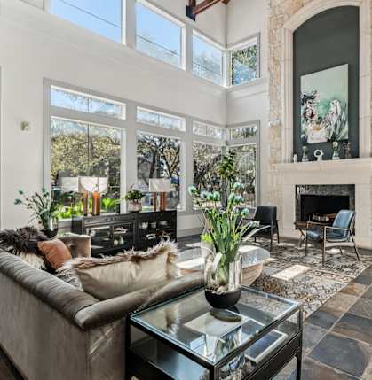 A living room with a fireplace and a couch.