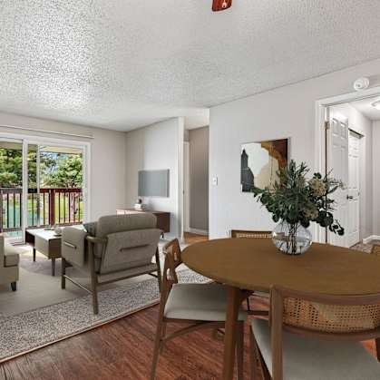 A living room with a brown table and chairs.