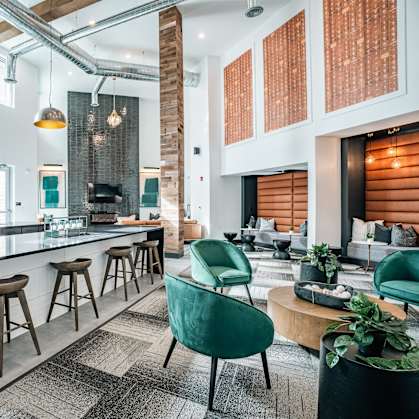 an open living room with a kitchen and a dining room
