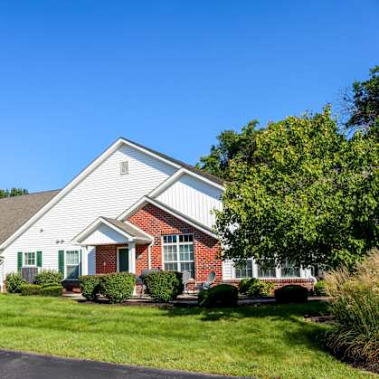 a large house with a lawn in front of it