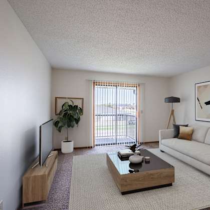 a living room with a white couch and a coffee table. Fargo, ND Bella Vista Apartments