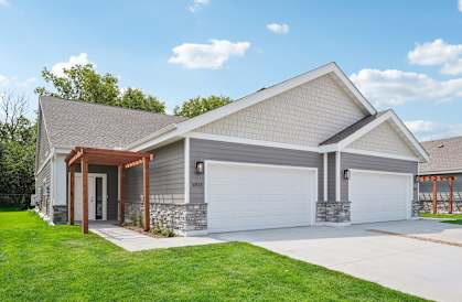 a house with a white garage door and a driveway