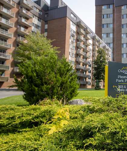 A sign in front of a building that says "Oscogles Pleasant Park Place 2025 2025 2025".