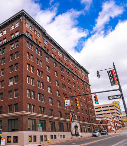 a large red brick building on a city street