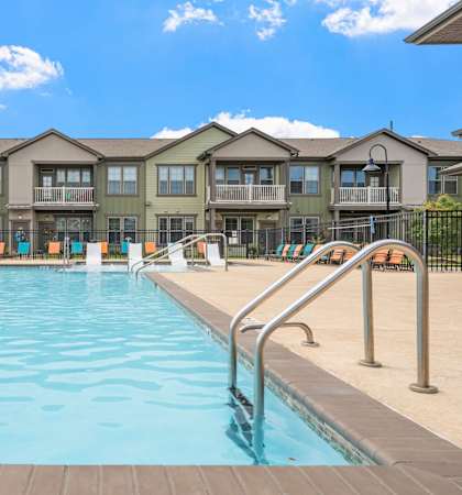 our apartments have a large swimming pool with chairs