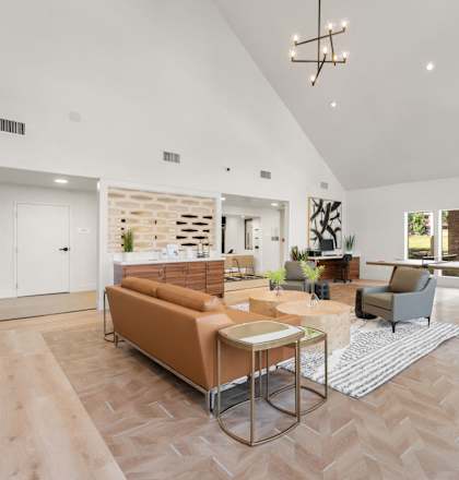 a living room with a couch and a table at AVIA Lofts on Parkway Apartments, Vancouver, 98662