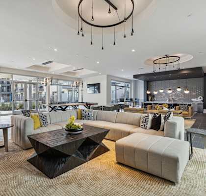 a living room with couches and chairs and a table