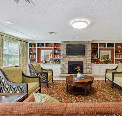 a living room filled with furniture and a fire place
