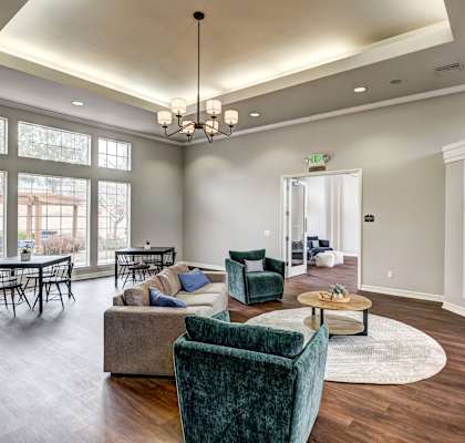 a living room with couches and chairs and a fireplace