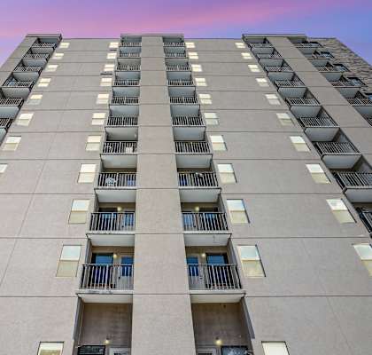 front view of an apartment building with balconies