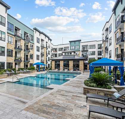 a swimming pool in the middle of an apartment building